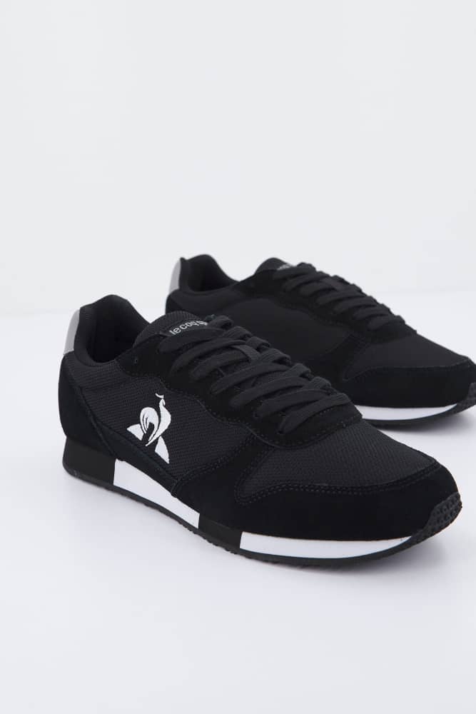 Baskets sport noires unisexes à semelle contrastée - Image 1